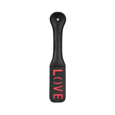 Black leather paddle with stitched edges and reversed red LOVE imprint on the striking surface, featuring a rounded handle.