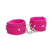 Pair of bright pink plush-lined leather wrist cuffs connected by a silver chain and clasp for adjustable restraint.