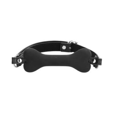 Black silicone bone-shaped gag with adjustable bonded leather strap and metal buckle.