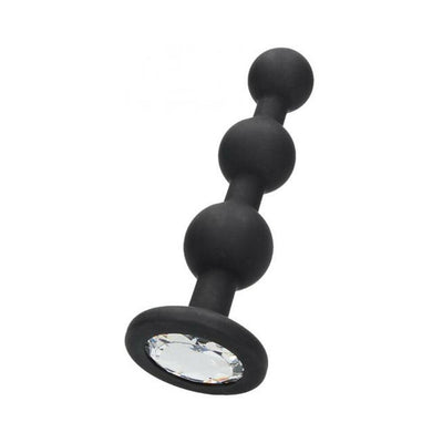 Black silicone beaded butt plug with graduated spheres and a crystal-studded flared base for easy handling.