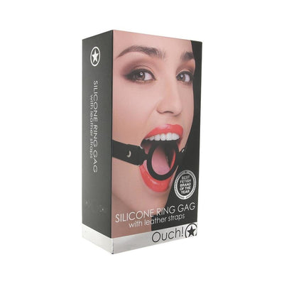 Packaging box for Ouch! Silicone Ring Gag with leather straps featuring a model wearing the black silicone ring gag.