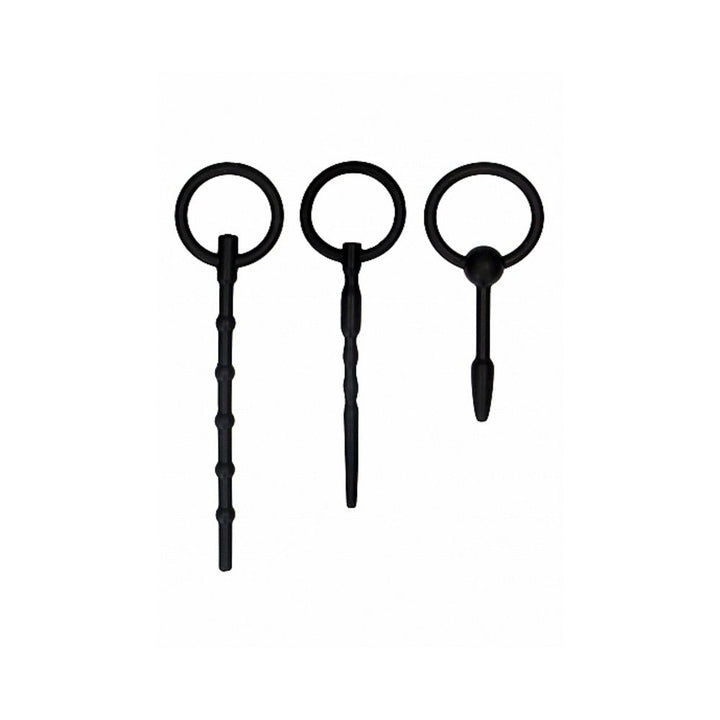 Set of three black silicone urethral sounding plugs with textured shafts and ring handles for safe control.