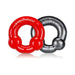 Two Oxballs cockrings in red and steel colors with dual nodules and embossed branding on a white background.