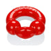 Red flexible cockring with dual nodules designed for comfort and performance enhancement.