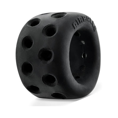 Black soft silicone ballstretcher with multiple ventilation holes and ergonomic design for comfortable wear.