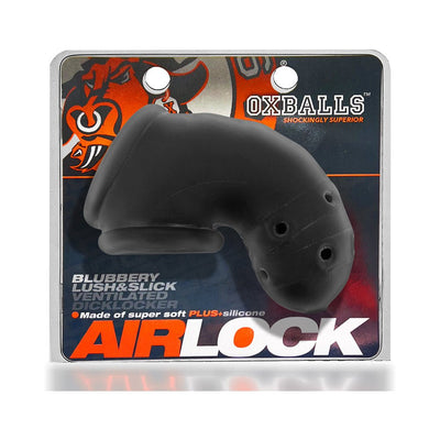 Black vented Airlock Air-Lite chastity cage made of soft silicone displayed on branded packaging.
