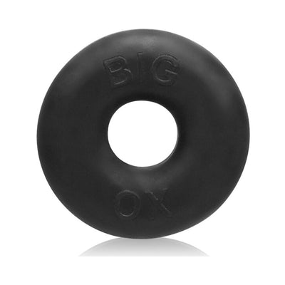Black circular Big Ox cock ring with a smooth matte finish and embossed branding on the surface.