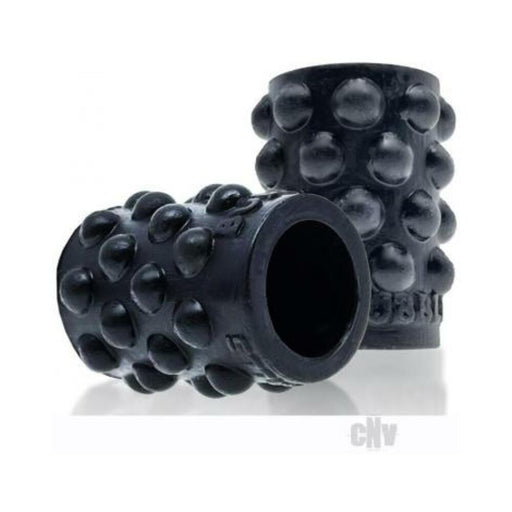 Black silicone nipsuckers with raised bubble texture for enhanced grip and suction, designed for nipple stimulation.