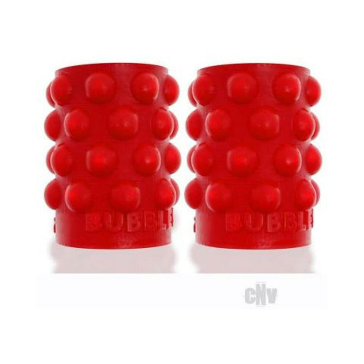 Pair of red silicone nipsuckers with raised bubble texture for enhanced grip and sensation.