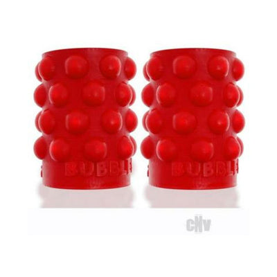 Pair of red silicone nipsuckers with raised bubble texture for enhanced grip and sensation.