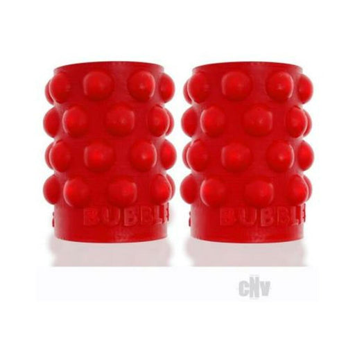 Pair of red silicone nipsuckers with raised bubble texture for enhanced grip and sensation.