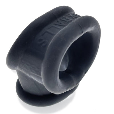 Black silicone cock and ball sling with a smooth, rubbery finish and embossed branding detail.