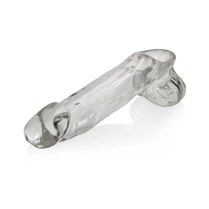 Clear flexible cock sheath with flared head and attached scrotum detail on white background.
