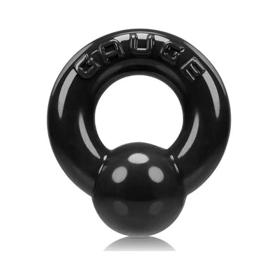 Black Oxballs Gauge cockring with bold embossed lettering and a smooth, glossy finish.