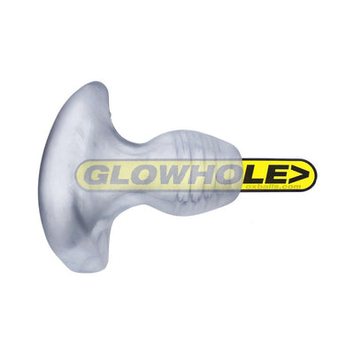 Small clear frosted Oxballs Glowhole-1 buttplug with ergonomic shape and LED insert shown on white background.