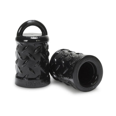 Pair of black textured nipple pullers with loop handles made of flexible material for secure fit and stimulation.