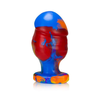 Large silicone buttplug in vibrant rainbow colors with a smooth, tapered design and flared base.