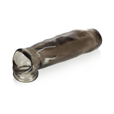 Transparent smoky gray flexible sleeve with a rounded tip and textured surface designed for intimate enhancement.