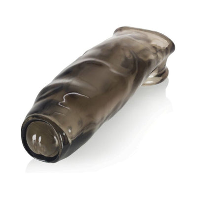 Transparent smoky gray flexible sleeve with textured surface and rounded tip, designed for intimate enhancement.