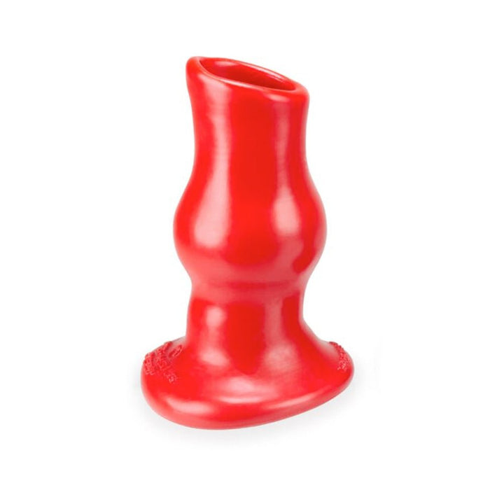 Small red hollow silicone plug with a tapered base and contoured shape for comfortable use.