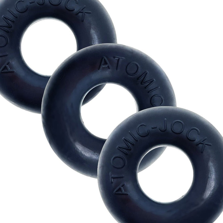 Three black Oxballs Ringer cockrings made from PLUS+silicone, arranged overlapping on a white background.