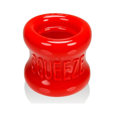 Bright red, thick, flexible ball stretcher with embossed "SQUEEZE" text on the side, designed for comfort and stretch.