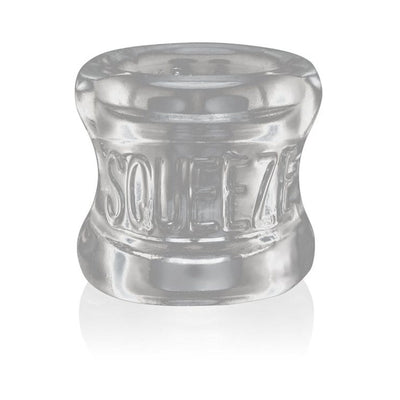 Clear flexible ball stretcher with embossed SQUEEZE branding and a soft, rounded design for comfortable wear.