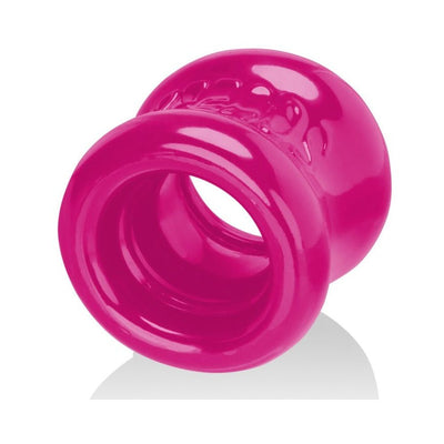Bright pink flexible ball stretcher with a thick, rounded design and soft padded ends for comfort and support.