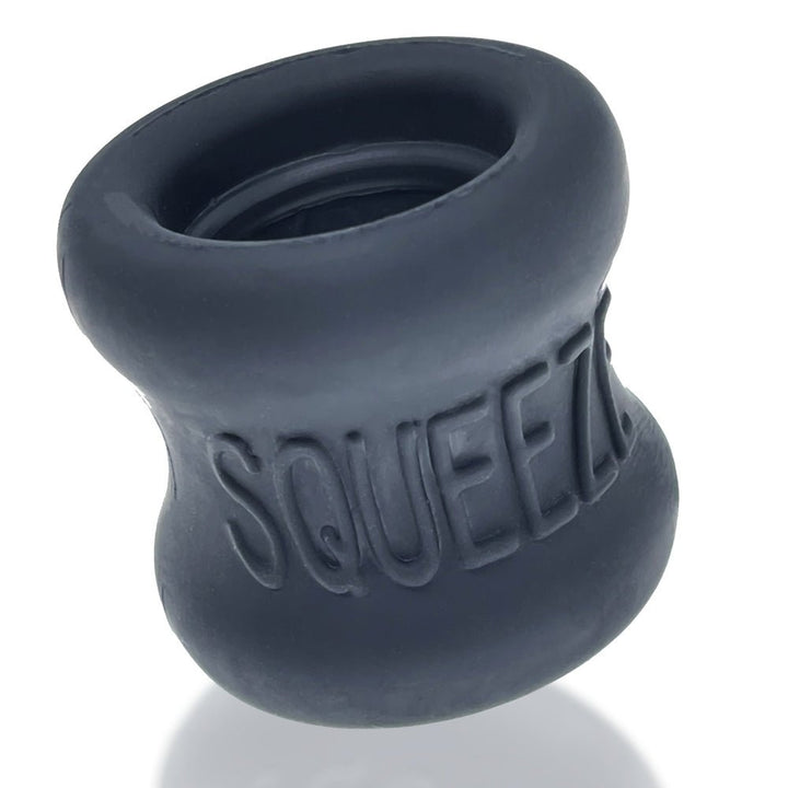 Black silicone hourglass-shaped ballstretcher with embossed SQUEEZE logo and smooth matte finish.