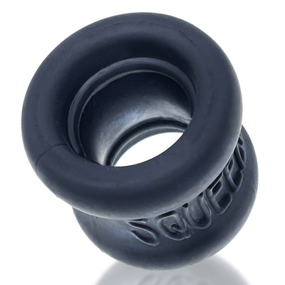 Black silicone hourglass-shaped ballstretcher with embossed SQUEEZE logo and smooth matte finish.