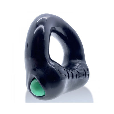Black Oxballs Stash cockring with a green aluminum capsule insert and embossed logo on a white background.