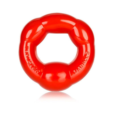 Red flexible cockring with a smooth, rounded design and embossed branding on a white background.