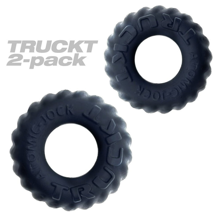 Two black textured cockrings from Oxballs Truckt 2-pack with raised lettering and a matte finish.
