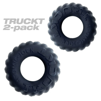 Two black textured cockrings from Oxballs Truckt 2-pack with raised lettering and a matte finish.