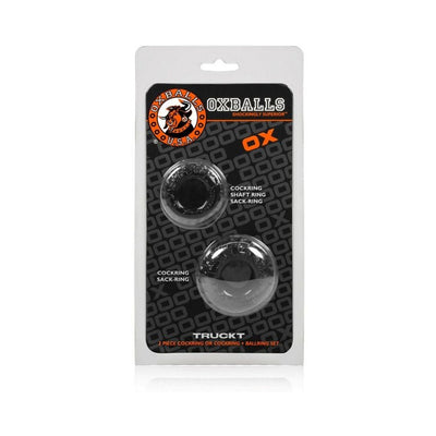 Oxballs Truckt two-piece black cockring and sackring set in clear plastic packaging with branded black and orange backing.