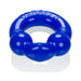 Blue flexible cockring with textured ball details and embossed branding on a white background.