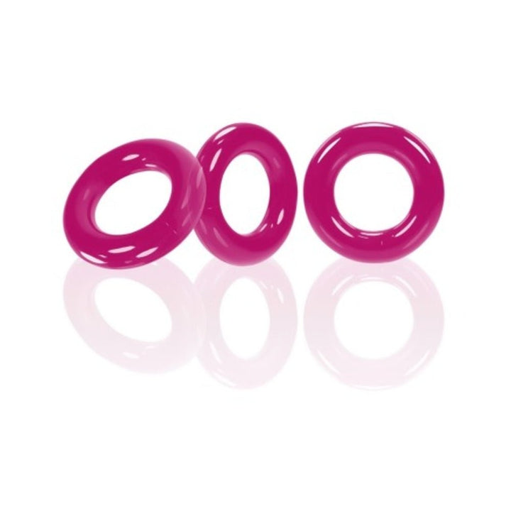 Three glossy magenta flexible rings displayed on a reflective white surface.