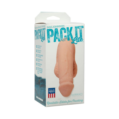 Pack It Lite realistic dildo packer in natural skin tone displayed in branded packaging with blue text and product details.