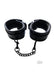 Black padded leather wrist cuffs with soft lining and detachable chain connectors, featuring lockable buckle closures.