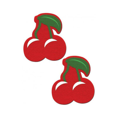 Pair of bright red cherry-shaped nipple pasties with green leaves and stems on a white background.
