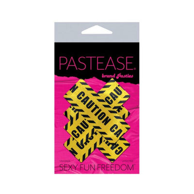 Pastease crossed caution tape nipple pasties in yellow and black on pink and black branded packaging.