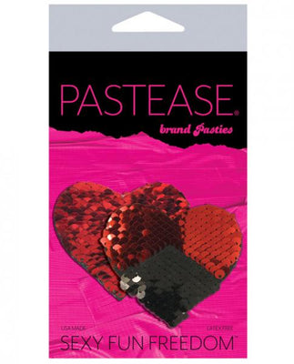 Red and black reversible sequin heart-shaped nipple pasties by Pastease in branded packaging