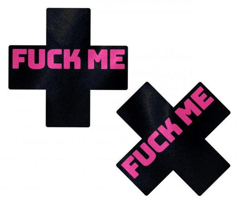 Black cross-shaped nipple pasties with bold pink "FUCK ME" text, designed for a playful and daring look.