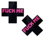 Black cross-shaped nipple pasties with bold pink "FUCK ME" text, designed for a playful and daring look.