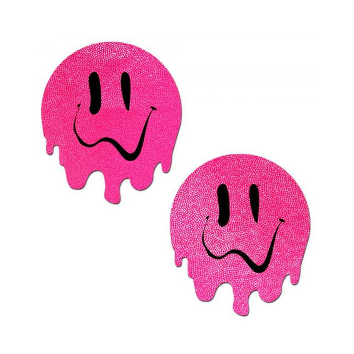 Pair of neon pink circular pasties with melting smiley face design in black, made from textured swimsuit material.