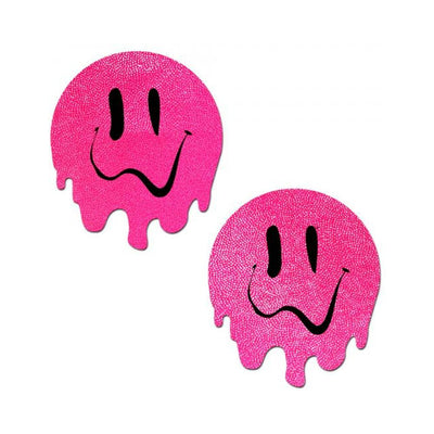 Pair of neon pink circular pasties with melting smiley face design in black, made from textured swimsuit material.