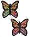 Pair of glittery pastel rainbow butterfly-shaped nipple pasties with black outlines and sparkling finish.