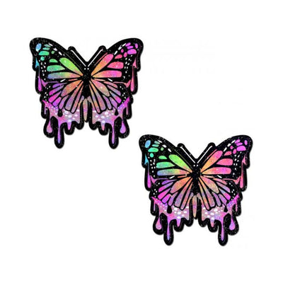 Pair of rainbow glitter butterfly-shaped nipple pasties with a dripping paint effect and black outlines.