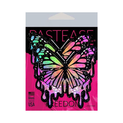 Rainbow glitter butterfly-shaped nipple pasties with a dripping paint design on pink and black packaging.