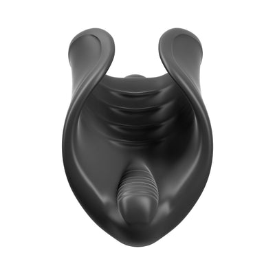 Black silicone vibrating stimulator with ribbed interior and curved design for targeted pleasure.